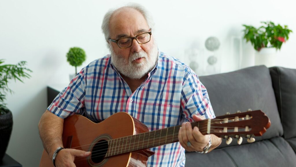 Old Man Playing a Guitar