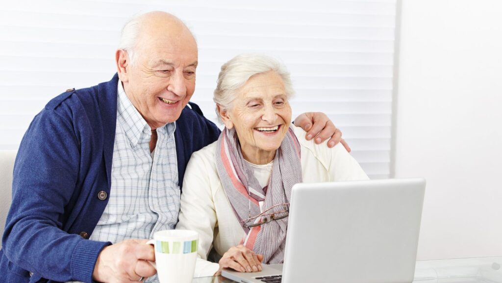 Senior citizens on computer